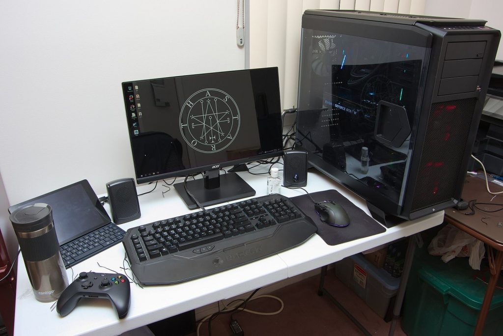 Desktop gaming PC setup with monitor, keyboard, mouse and speakers