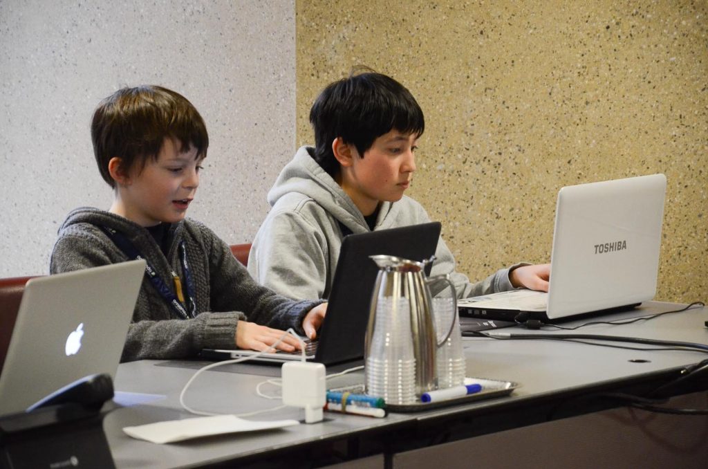 Children building together in Minecraft at a workshop
